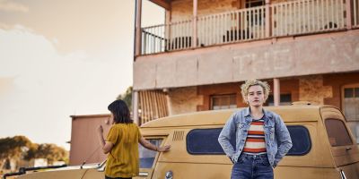Jessica Henwick, left, and Julia Garner, right, in a scene from "Royal Hotel." (Neon)