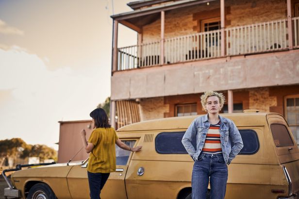 Jessica Henwick, left, and Julia Garner, right, in a scene from "Royal Hotel." (Neon)