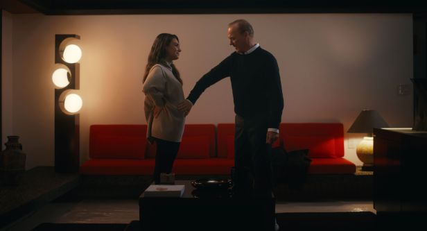 Mila Kunis and Michael Keaton in a scene from "Goodrich."