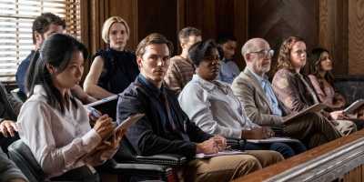 Nicholas Hoult as Justin Kemp, Leslie Bibb as Denice, Adrienne C. Moore as Yolanda and J.K. Simmons as Harold in "Juror #2,” (Claire Folger/Warner Bros. Pictures)