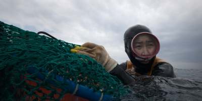 A haenyeo diver of South Korea’s Jeju Island in “The Last of the Sea Women.” (Apple TV+).