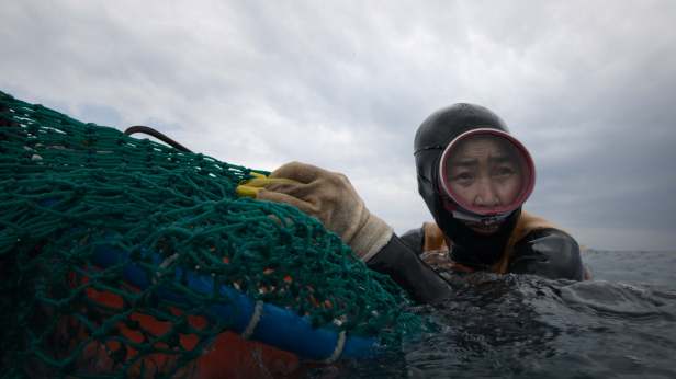 A haenyeo diver of South Korea’s Jeju Island in “The Last of the Sea Women.” (Apple TV+).
