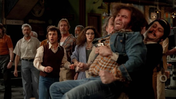 From left, Lorne Michaels (Gabriel LaBelle) and Gilda Radner (Ella Hunt) watch John Belushi (Matt Wood) and Dan Aykroyd (Dylan O'Brien) get into it. (Sony Pictures)