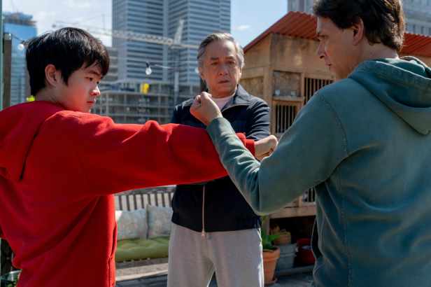 Ralph Macchio, Ben Wang and Jackie Chan in “Karate Kid: Legends.” (Sony Pictures)