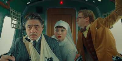 Benicio del Toro, Mia Threapleton, and Michael Cera in '"he Phoenician Scheme." (Focus Features)