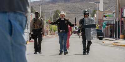 Micheal Ward, Joaquin Phoenix and Luke Grimes in a scene from "Eddington." (Richard Foreman/A24)