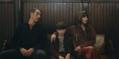 Michael Angelo Covino, Simon Webster and Dakota Johnson in "Splitsville." (Neon)