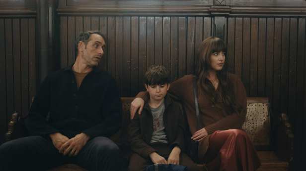 Michael Angelo Covino, Simon Webster and Dakota Johnson in "Splitsville." (Neon)