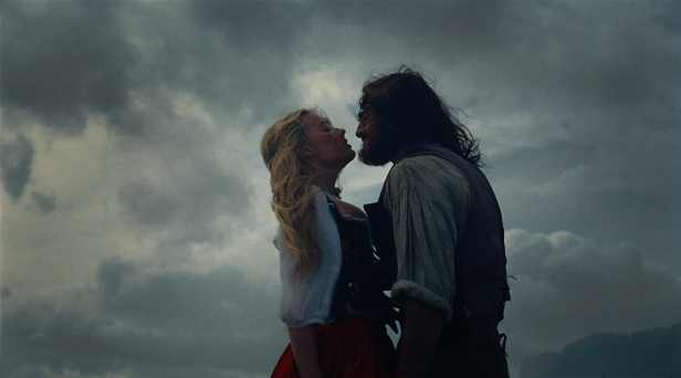 Margot Robbie and Jacob Elordi in a scene from “Wuthering Heights.” (Warner Bros. Pictures)