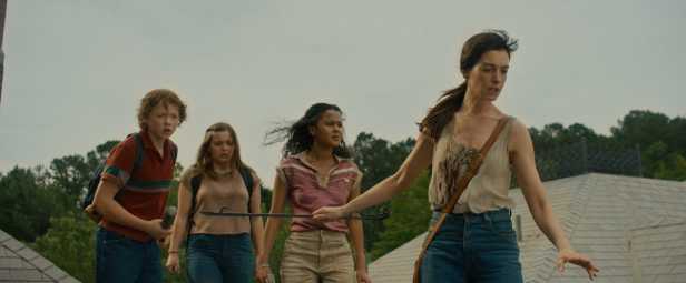 From left: Christian Convery, Maisy Stelly, Jordan Alexa and Anne Hathaway in “The End of Oak Street.” (Warner Bros. Pictures)