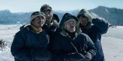 Genden Phuntsok, Tom Hiddleston, Willem Dafoe and Benjamin Hoetjes in "Tenzing," now streaming on Apple TV.